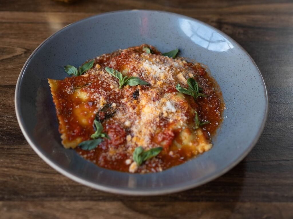 Fresh pasta filled with spinach and ricotta in a slowly roasted San Marzano tomato sauce.